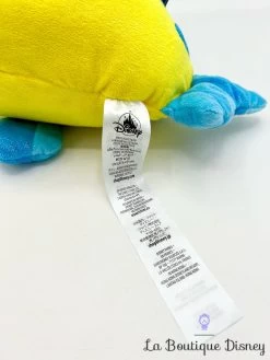 Peluche Polochon La Petite Sirène Disney Store 2023 Poisson Jaune Bleu 38 Cm -Poupées Soldes peluche polochon brillant disney store peluche poisson jaune bleu la petite sirene 6